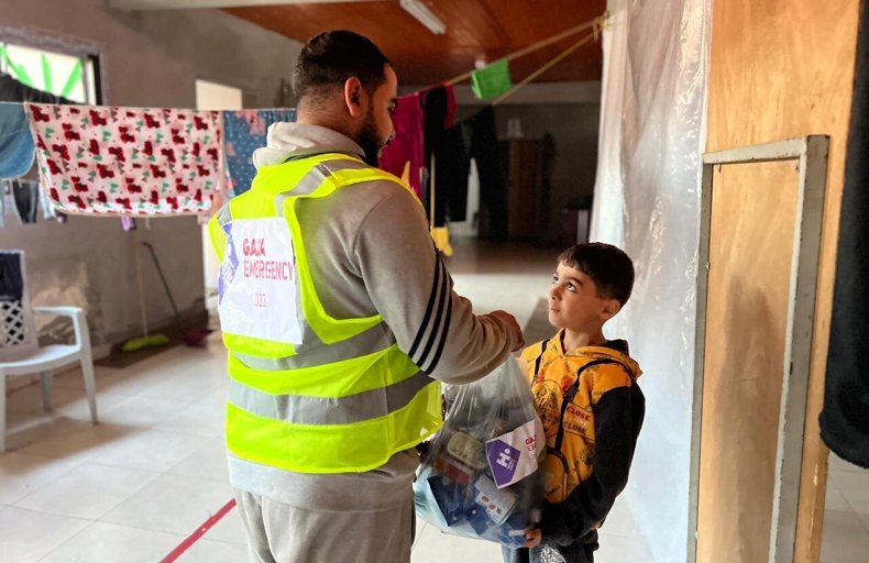 Child being provided with an aid parcel