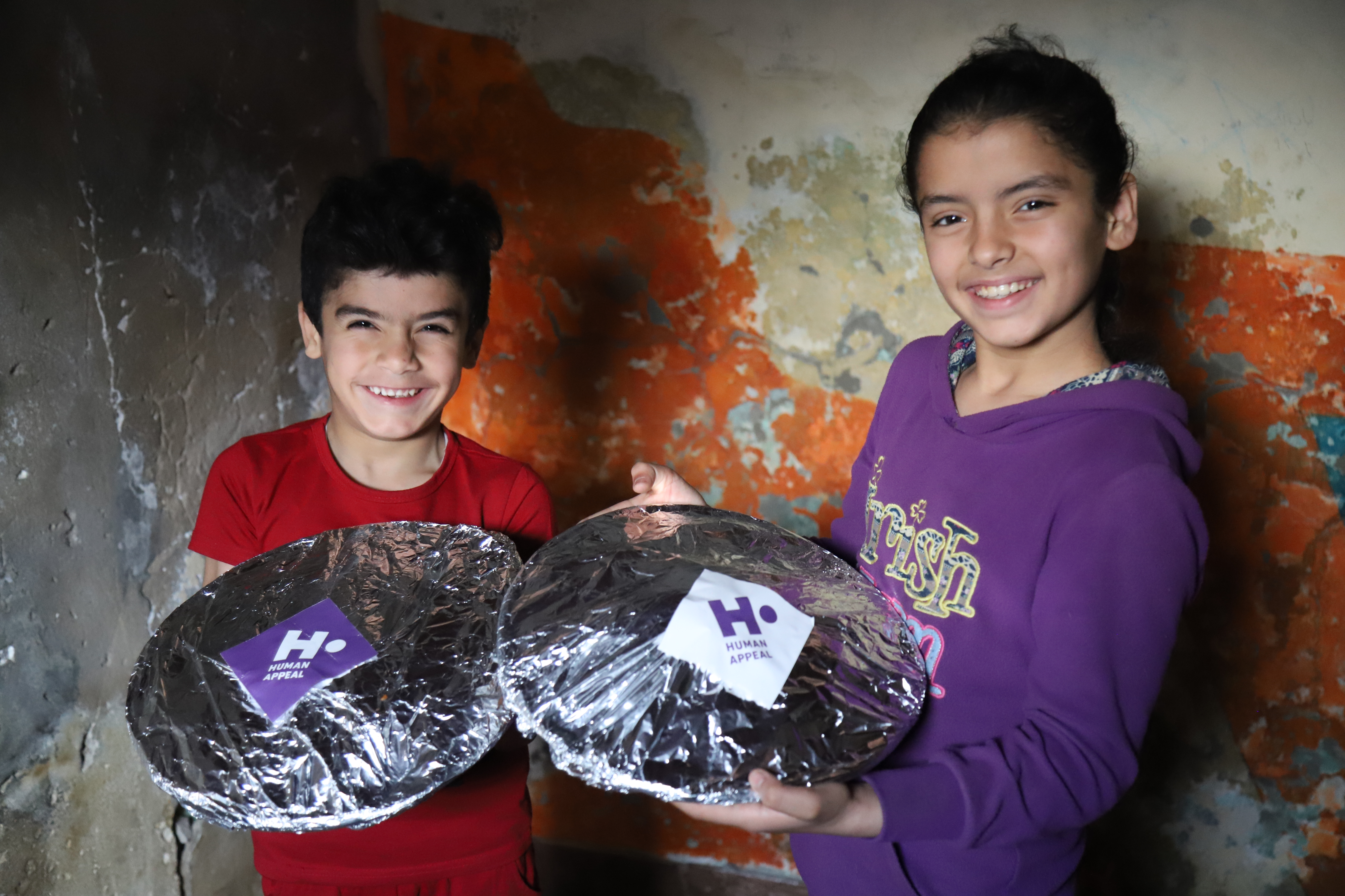 Children holding hot meals