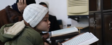 Boy reading the Qur'an