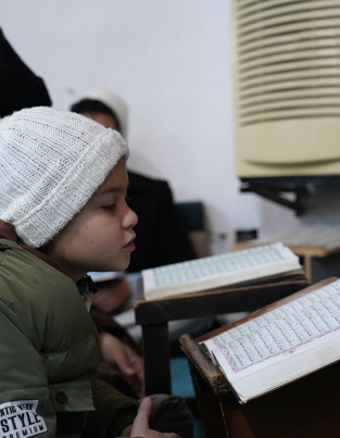 Boy reading the Qur'an