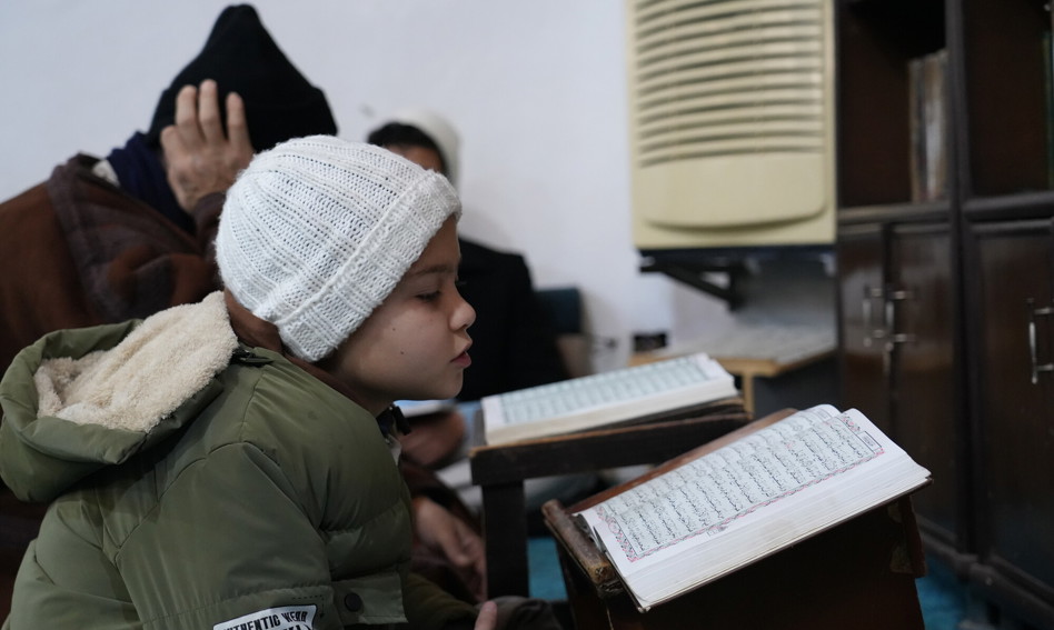 Child reading the Qur'an