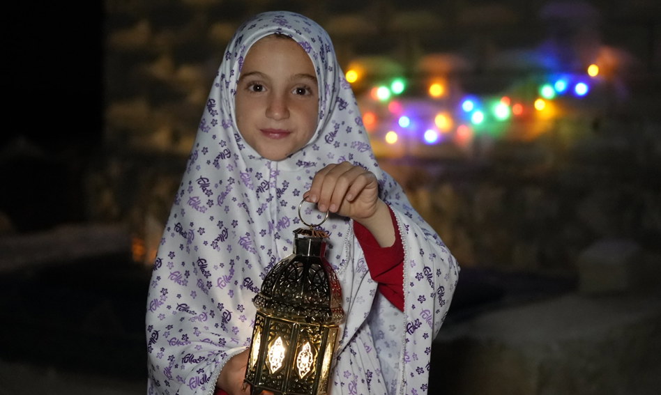 Girl holding a lantern during Ramadan