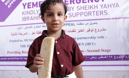 Boy holding bread