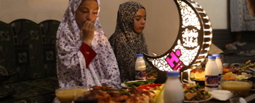 Young girls eating iftar