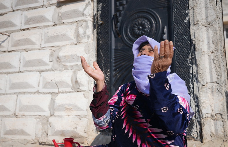 Woman praying during the winter