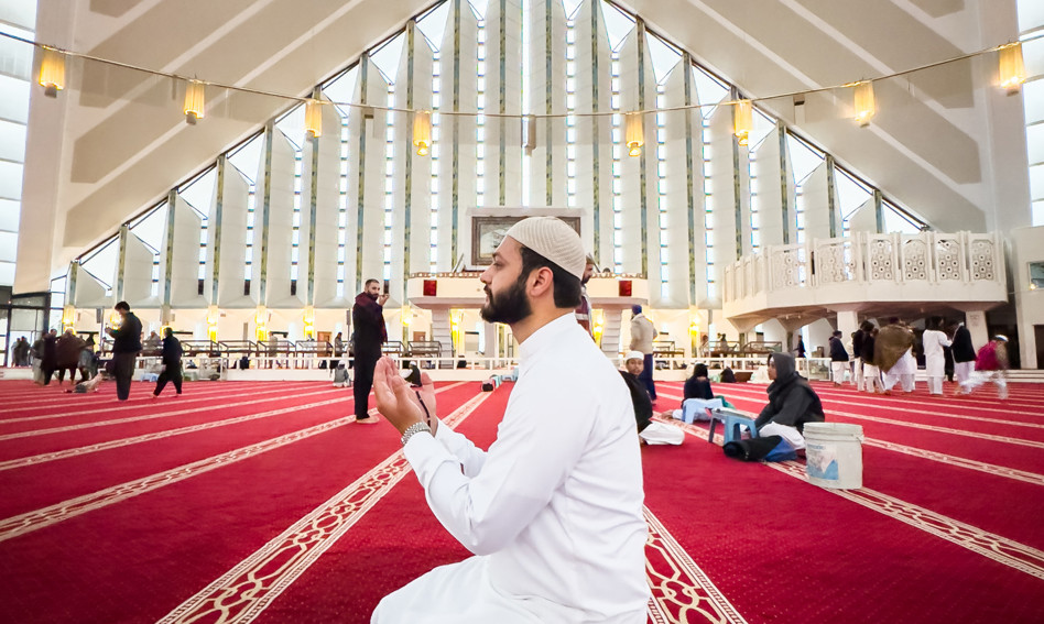 Man praying in Faisal mosque