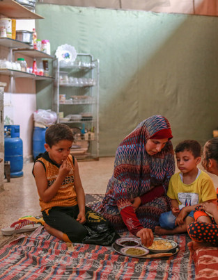 Mother and children eating Suhoor