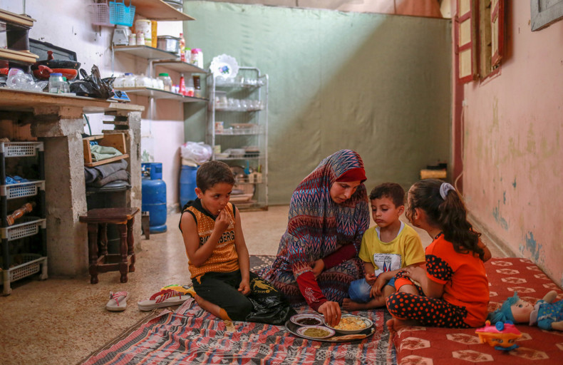 Mother and children eating Suhoor