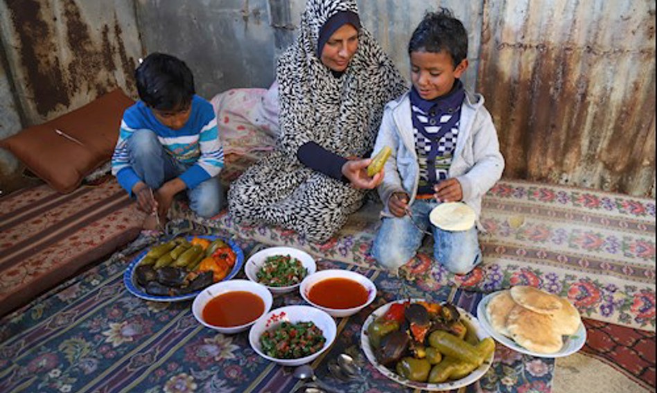 Family with several dishes prepared before them