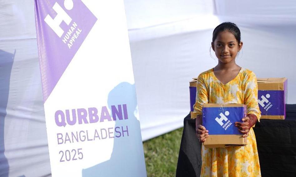 Child holding Qurbani box