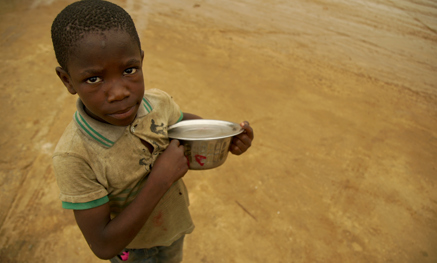 Child with empty bowl