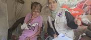 Our field team registering Reema's case in Gaza.