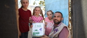 Qurbani package being provided to children. 