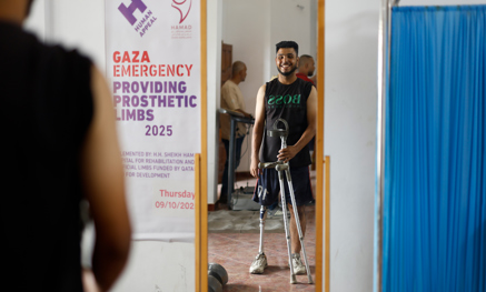Man with prosthetic leg looking in the mirror