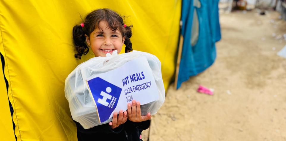 Children holding hot meals
