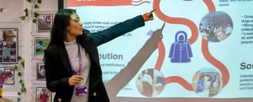 Woman explains the journey of a coat during Human Appeal's Wrap Up campaign