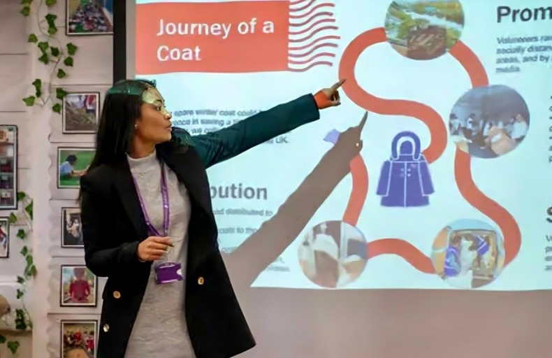 Woman explains the journey of a coat during Human Appeal's Wrap Up campaign