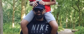 Zaheer's son riding on his father's shoulders