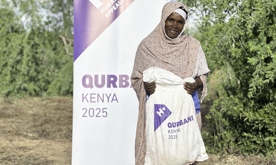 Woman holding Qurbani bag
