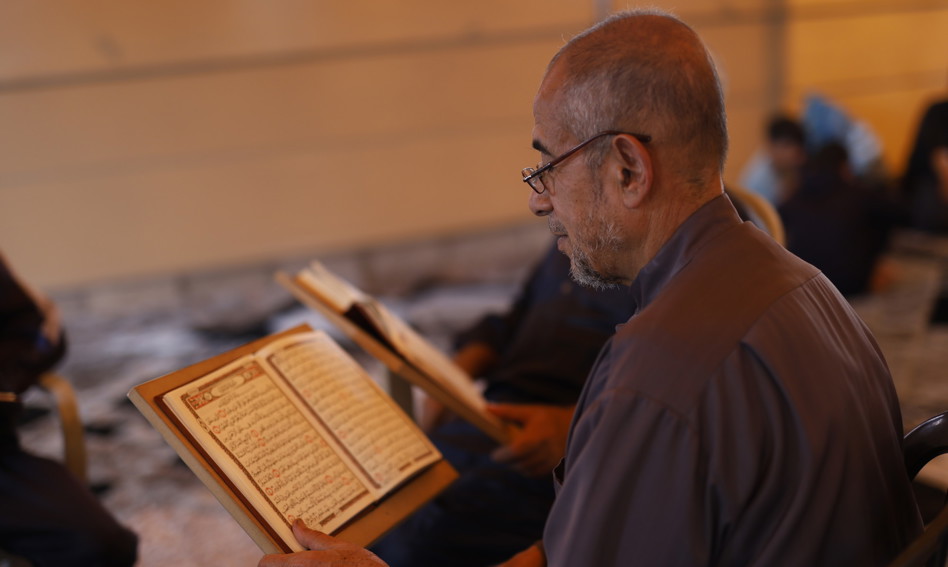 Man reading the Qur'an