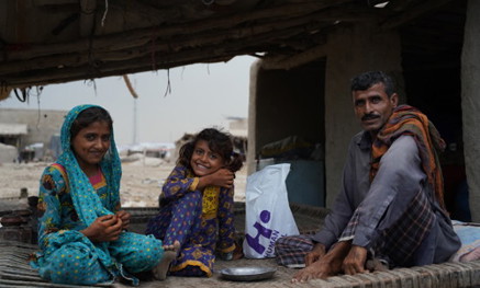 Family with Qurbani parcel