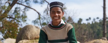Child in  Pakistan with a winter kit