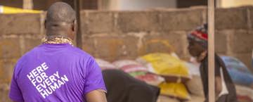Human Appeal staff looking at people collecting food parcels