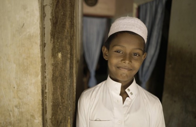 Child standing in a doorway