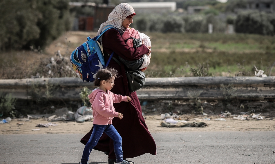 Mother and child fleeing from Gaza