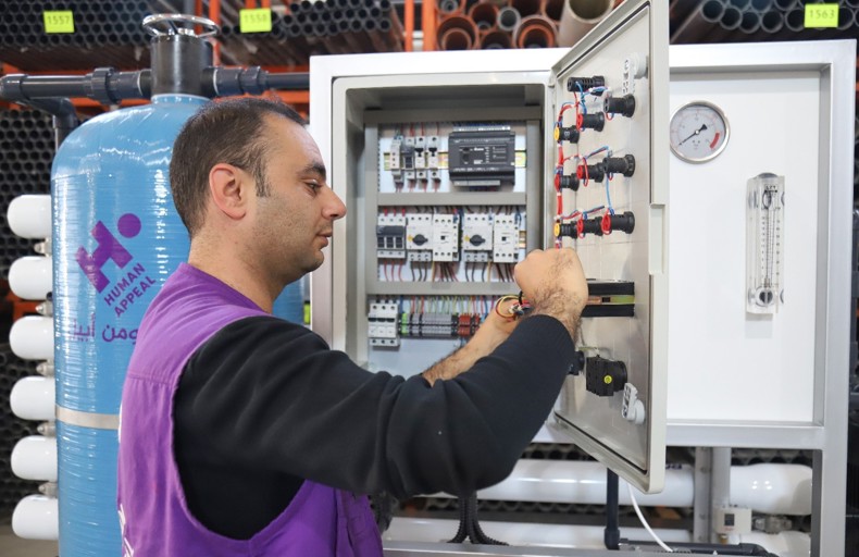 Human Appeal technician inside a water desalination plant in Gaza