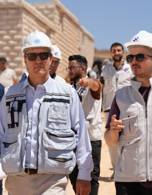 UN Deputy Regional Humanitarian Coordinator David Carden (left), visiting Al Yasameen Town for IDPs in northwest Syria with Dr. Ubeyd Sakin (right), Human Appeal’s Country Director for Turkey & Syria.