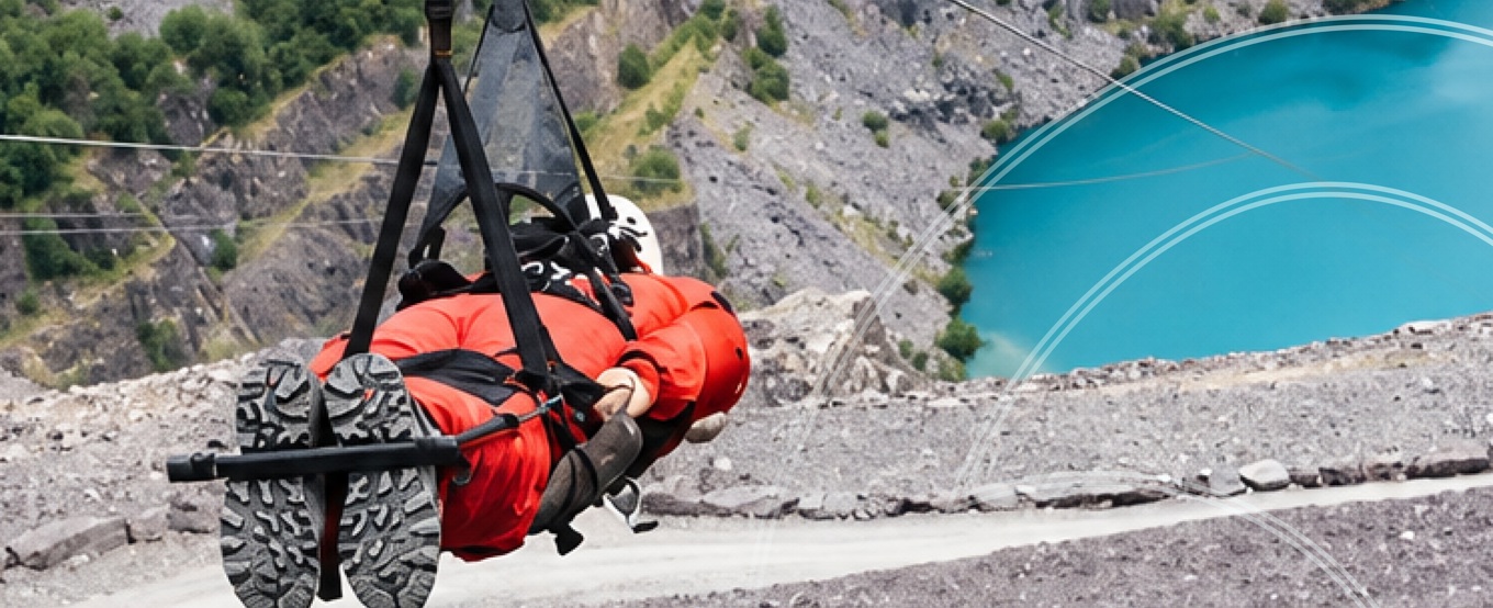 Participant ziplining over Penrhyn Quarry at Zip World on a Human Appeal Gaza fundraising challenge.