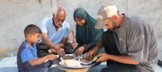 Family eating a meal made from Qurbani meat. 