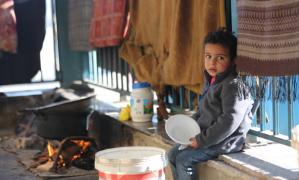 Child holding an empty bowl