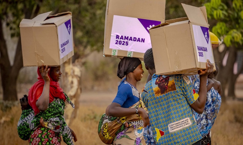 Women carrying food parcels