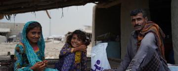 Family with their Qurbani parcel