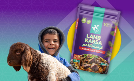 Child holding Qurbani bag