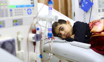 Child laying on hospital bed