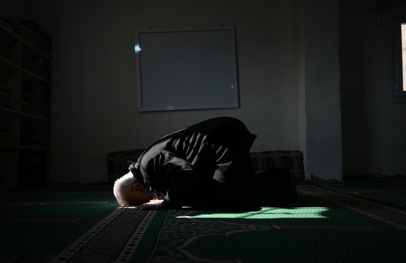 Man praying in a mosque in a state of itikaf