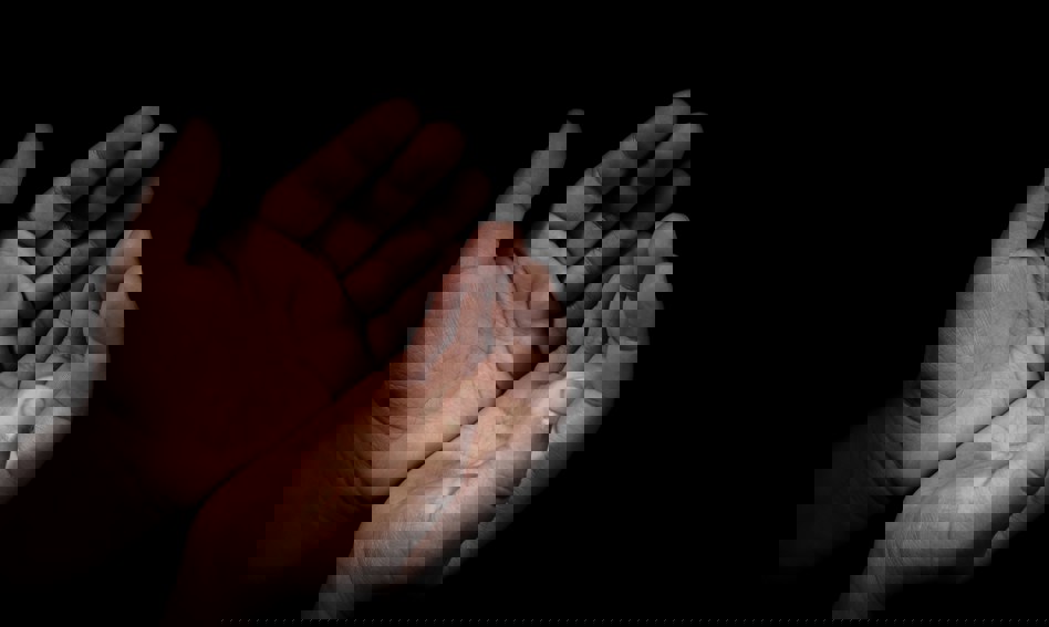 Hands held in prayer