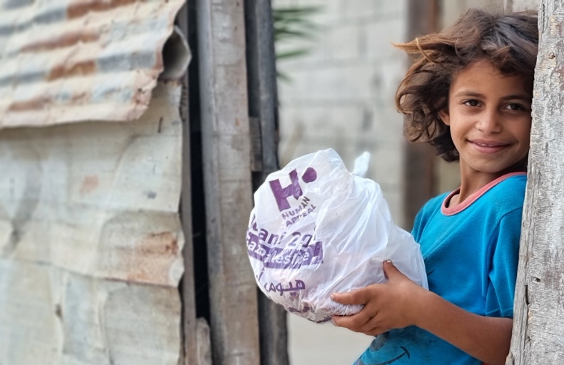Child in Gaza collecting Qurbani meat